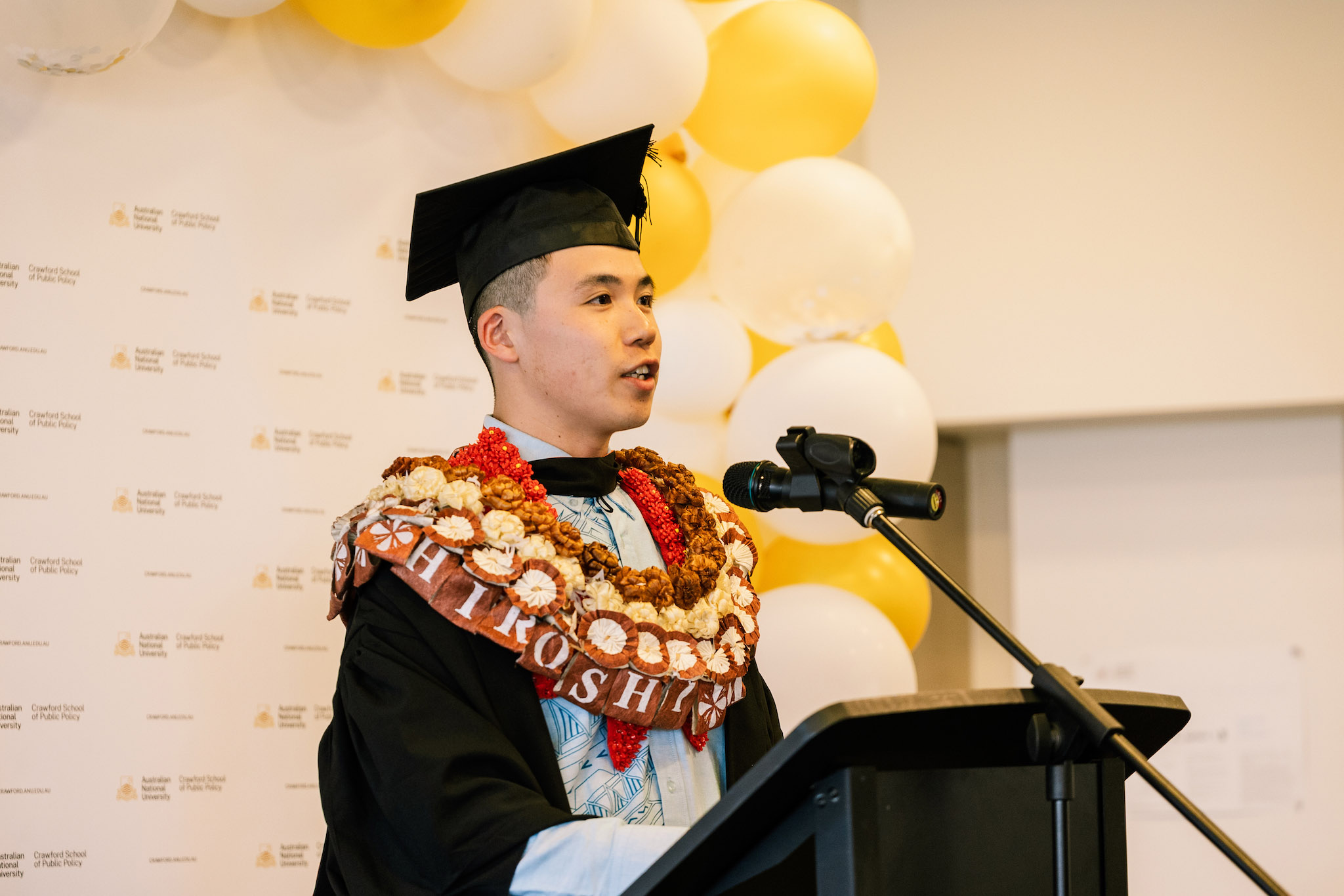 A graduate from Crawford School of Public Policy giving a speech at the School's post-graduation get together A graduate from Crawford School of Public Policy giving a speech at the School's post-graduation get together