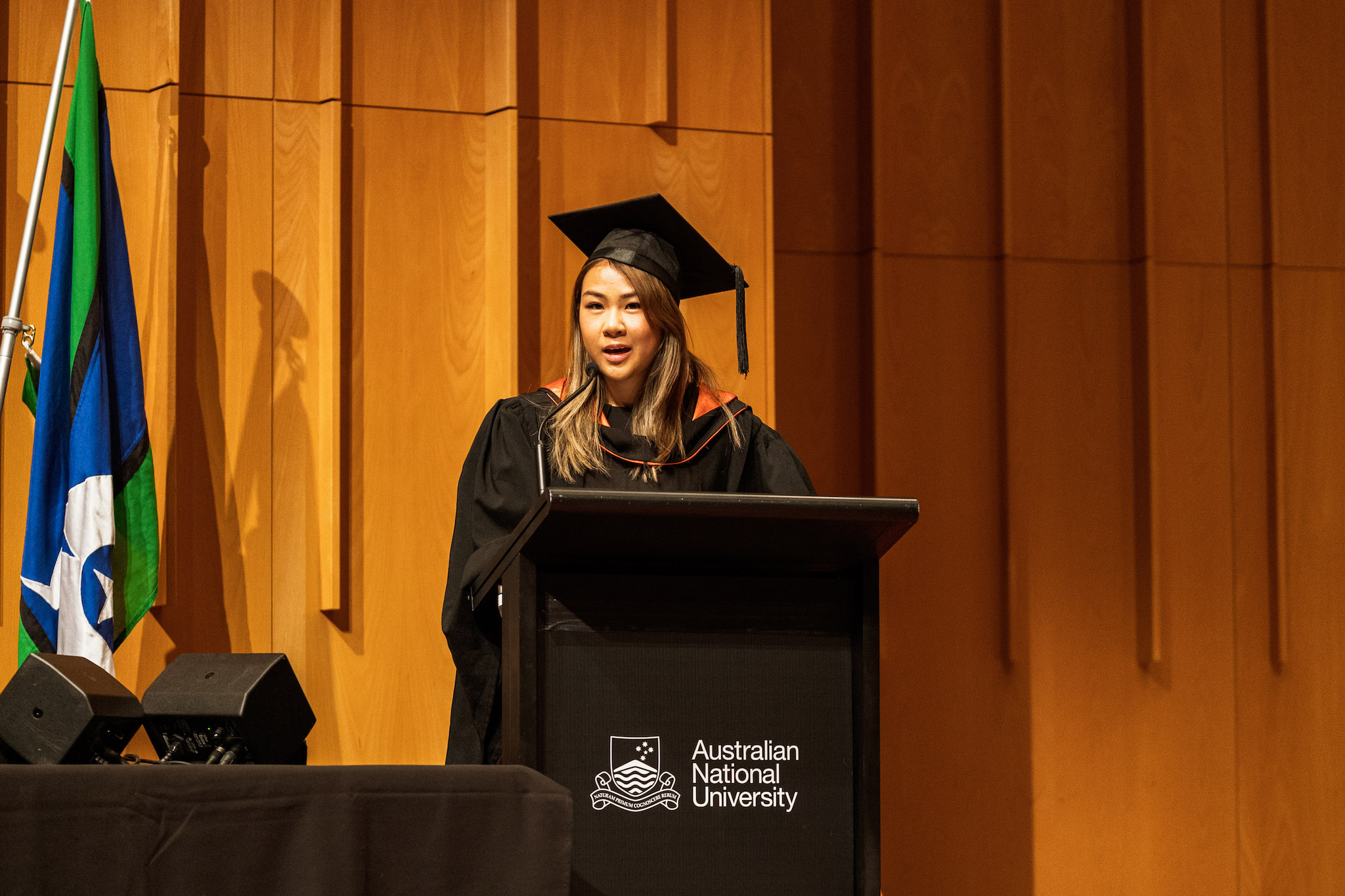 A student giving a speech at the Mid-Year Graduation inside Lewellyn Hall A student giving a speech at the Mid-Year Graduation inside Lewellyn Hall